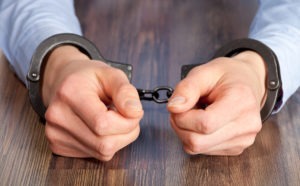 DUI Lawyer in Ridgecrest | Free Consultations 24/7 a close-up of a man’s hands in handcuffs