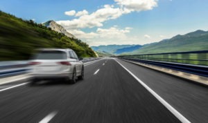 Exhibition of Speed CVC 23109c in California | What to Know a car speeding down the highway