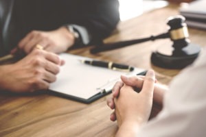 Sexual Misconduct Lawyer in Tustin | Free Consultations 24/7 attorney and client consult at table