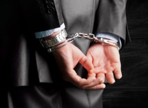 Ventura White Collar Crimes Attorney | Simmrin Law Group businessperson in handcuffs
