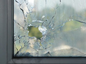 gunshot hole through window