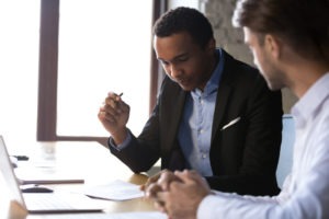 Los Angeles Sexual Battery Defense Lawyers | We Fight for Your Defense lawyer reviewing legal paperwork with client