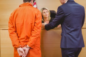 Date Rape Lawyer in Carlsbad | Simmrin Law Group lawyer with defendant speaking to judge in court