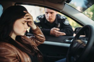 Carlsbad Traffic Violation Lawyers | Simmrin Law Group police officer questions distraught driver