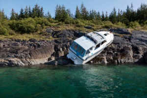 Boating Accident Lawyer in Los Angeles | Simmrin Law Group | Call 24/7 a boat that has run up on the rocks