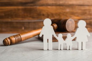 Family Lawyer in Los Angeles | Simmrin Law Group | Free Consultations a small wooden family and a judges gavel