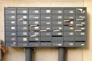 Mail Fraud Lawyer in Los Angeles | Free Consultations 24/7 apartment mailboxes filled with various mail