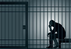 Date Rape Lawyer in Los Angeles | Free Consultations 24/7 silhouette of man sitting in jail cell