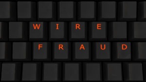 Wire Fraud Lawyer in Los Angeles, CA | Simmrin Law Group | Call Us 24/7 the words wire fraud on a keyboard