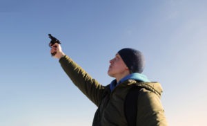 Negligent Discharge of a Firearm Defense Lawyer in Los Angeles | Free Consultations 24/7 young man firing gun into air