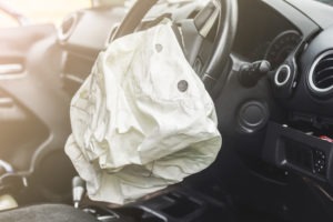 Car Accident Lawyer in Los Angeles | Free Consultations 24/7 interior of a car after the steering wheel airbag deployed