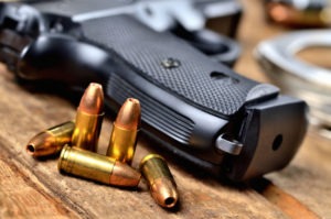 bullets beside a handgun