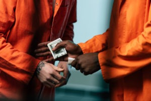 PC 4573 in California: Bringing Drugs Into Jail or Prison two prisoners engaged in a drug deal