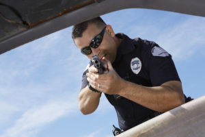PC 196: Justifiable Homicide by Peace Officers male police officer aiming gun