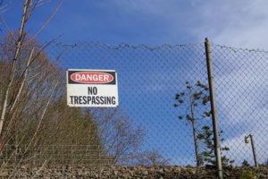 Penal Code 198.5 in California: Castle Doctrine | What to Know no trespassing sign on fence