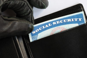 Identity Theft Lawyer in Long Beach | Free Consultations 24/7 person stealing Social Security card