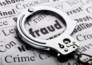 What Is White-Collar Crime?: What to Know | Simmrin Law fraud definition highlighted with handcuffs
