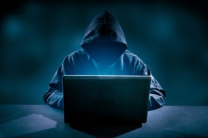 Identity Theft Lawyer in Burbank | Free Consultations 24/7 hacker using laptop hacking internet