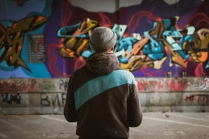 Property Crime Lawyer in Lynwood | Free Consultations 24/7 man-standing-near-a-wall-of-graffiti
