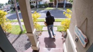 Property Crime Lawyer in Ontario | Free Consultations 24/7 man stealing package from front step