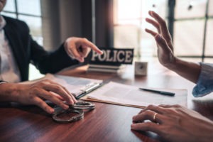 DUI Lawyer in Palms | Free Consultations 24/7 suspect in handcuffs being interviewed
