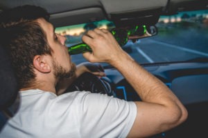 DUI Lawyer in West Hollywood | Free Consultations 24/7 man drinking beer while driving