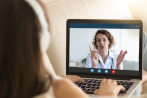 patient attending a therapy session online