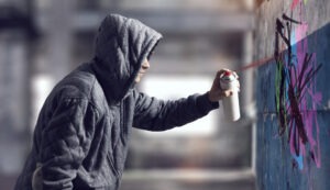 vandal spraying graffiti