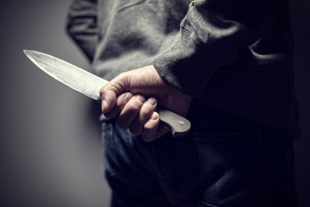 https://www.simmrinlawgroup.com/wp-content/uploads/2023/05/man-holding-knife-behind-his-back-1024x683.jpg