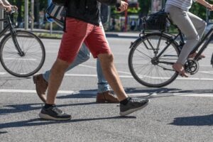 Pedestrian Accident Lawyer in Glendale | Free Consultations 24/7 walkers next to bikers on the road