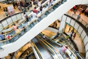 Shopping Mall Slip and Fall Lawyer in Los Angeles people on motion escalators modern shopping mall