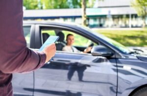 Uber Accident Lawyer in Pasadena | Free Consultations 24/7 person getting picked up by rideshare