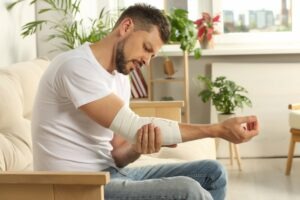 Dog Bite Lawyer in Pasadena | Free Consultations 24/7 man with arm wrapped in a medical bandage