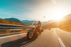 Motorcycle Accident Lawyer in Pasadena | Free Consultations 24/7 motorcycle rider driving at dusk