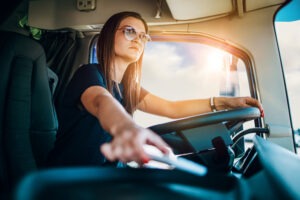 Semi-Truck Accident Lawyer in Irvine | Free Consultations 24/7 woman operating a semi-truck