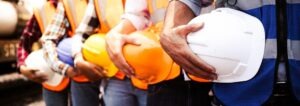 Construction Accident Lawyer in Pasadena | Free Consultations 24/7 A line of construction workers. You can get professional help from a Pasadena construction accident lawyer.