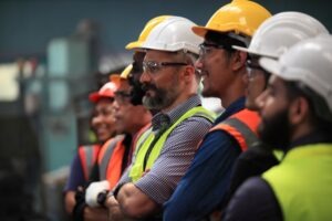 Construction Accident Lawyer in San Diego | Free Consultations 24/7 A row of construction workers. A San Diego construction accident lawyer can help you following a workplace injury.