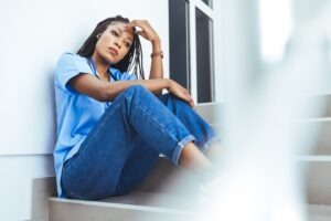 black nurse upset on stairs