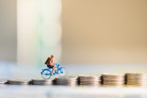 Bicycle Injury Settlements in California | Simmrin Law Group A bicycle toy rides up coins. What’s the average bicycle injury settlement in California?