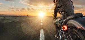 Motorcycle Accident Lawyer in Lake Forest | Free Consultations 24/7 Motorcyclist riding on road in Lake Forest.