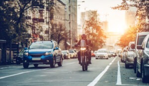 Motorcycle Accident Lawyer in El Monte | Free Consultations 24/7 Person rides motorcycle on El Monte street.