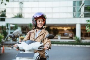 Motorcycle Accident Lawyer in Chula Vista | Free Consultations 24/7 Woman riding motorcycle through streets of Chula Vista
