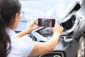 Woman takes picture after Los Angeles car accident.