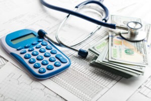A stack of money by a stethoscope. Find out what damages you can seek in a personal injury case with our team.