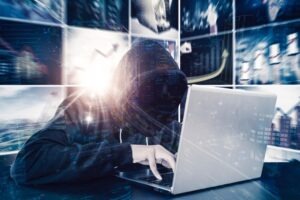 530.5 PC: Identity Theft Laws in California | What to Know A hooded man on a computer. You can speak with us about California Penal Code Section 530.5: Identity Theft.