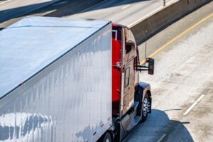 CVC 21651 | What Is a Divided Highway | Simmrin Law Group A red truck is driving on a divided highway. Talk to an experienced Los Angeles lawyer to learn when a roadway is considered a divided highway.