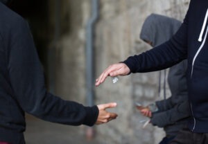 Will I Be Arrested if I Give My Friend Drugs in California?