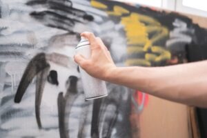 Someone uses a spray paint can to do graffiti on public property. Learn about California Penal Code §594: Vandalism here.