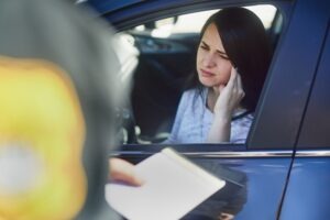 Why Glendale DUI Enforcement Matters | Simmrin Law Group A police officer speaks with a driver at a DUI checkpoint in Glendale, California, as a result of Glendale PD’s aggressive traffic enforcement.